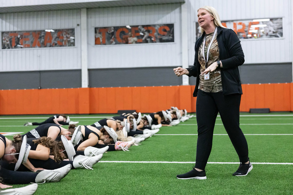 With her Highsteppers lined up, Director Amber Reynolds talks in the multipurpose facility on Sept. 21, 2023. Reynolds was on maternity leave and has now returned to work for the remainder of the 2023-2024 school year.