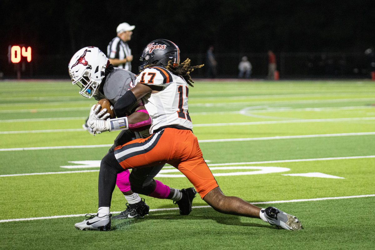 Junior defensive back, Alex Jones dives for the tackle on the Marshall Mavericks. The Tigers played the Mavericks away on Oct. 13, 2023.