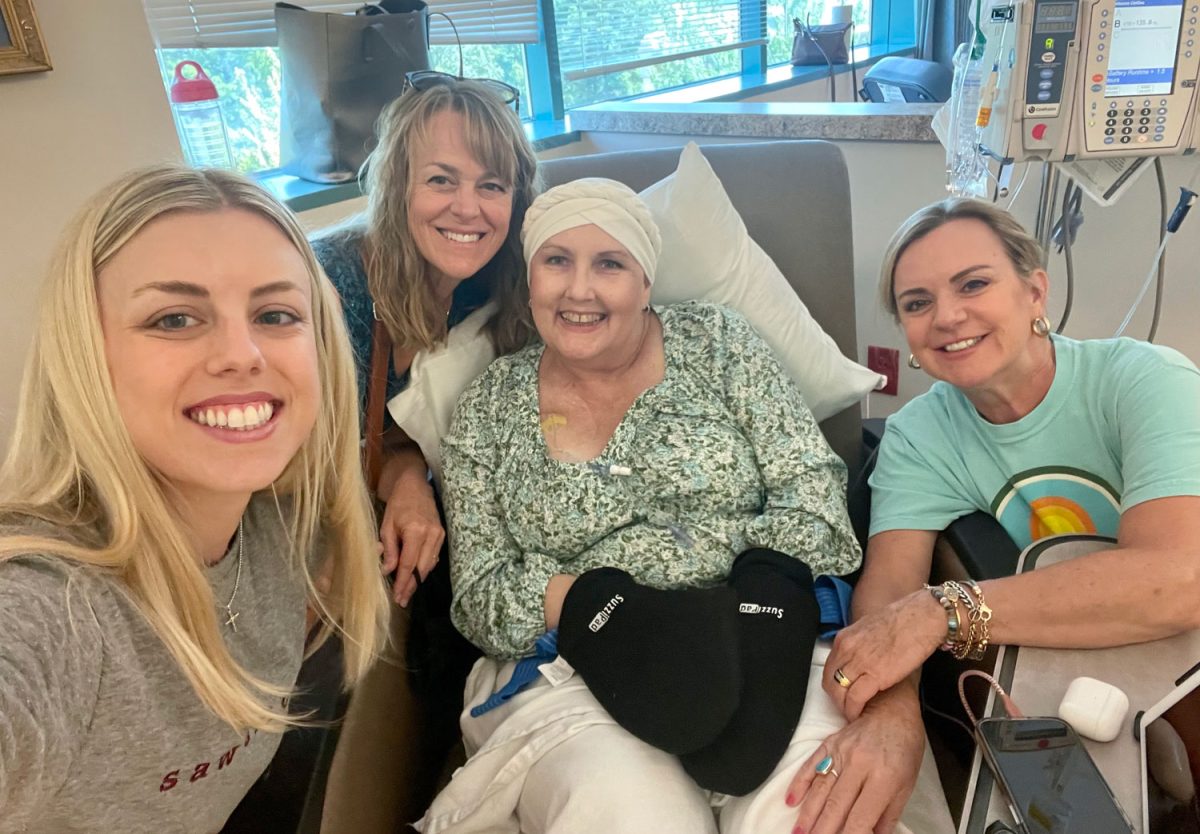 Jennifer Unger sits by her peers during one of her treatments for cancer. Unger broke the news to her son, Tyler Unger, in April of 2023.