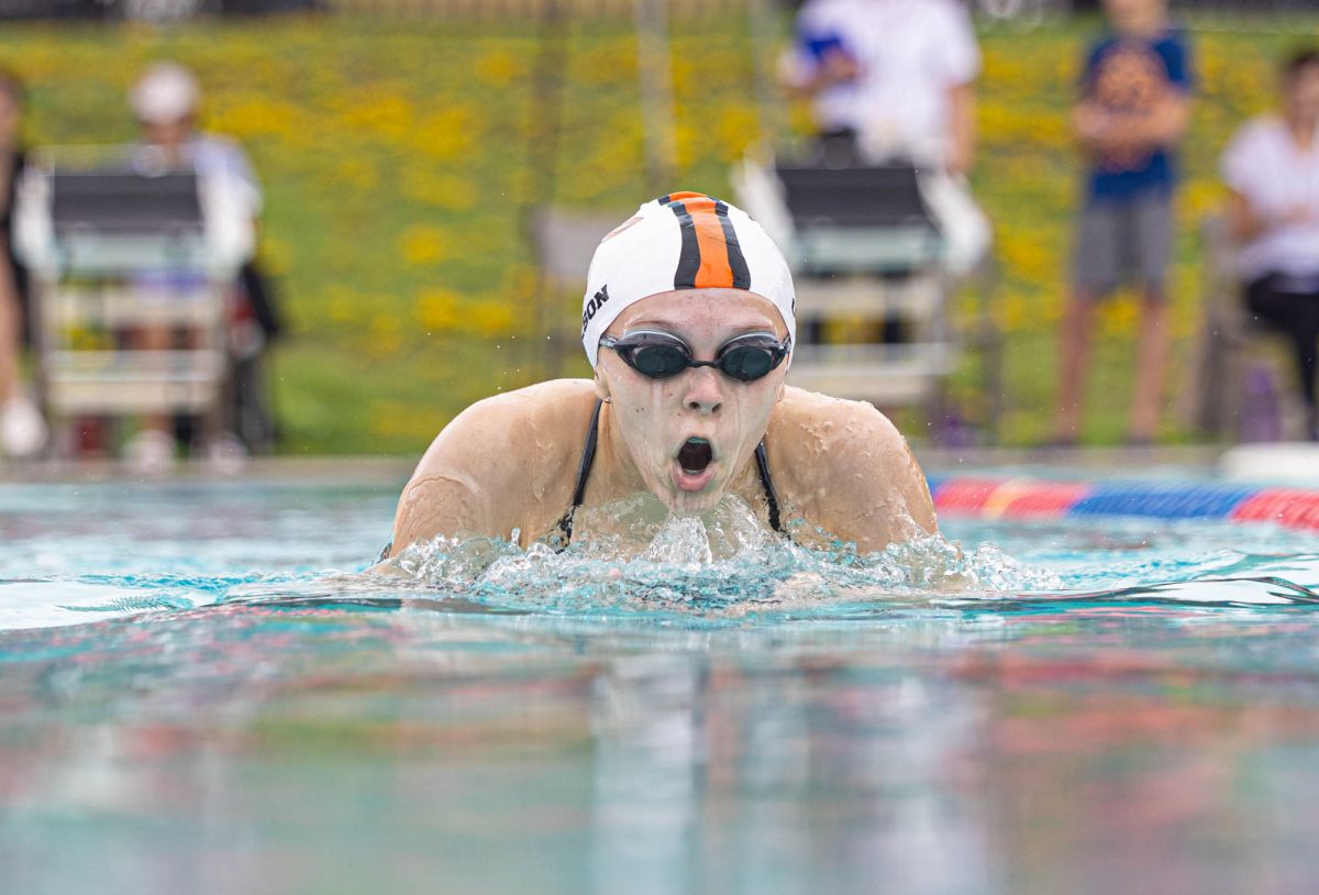 Briefly leaving the water, Maya Olsen competes in the Tyler Tri Swim meet. The meet was held at the Tyler ISD pool on October 28, 2023.