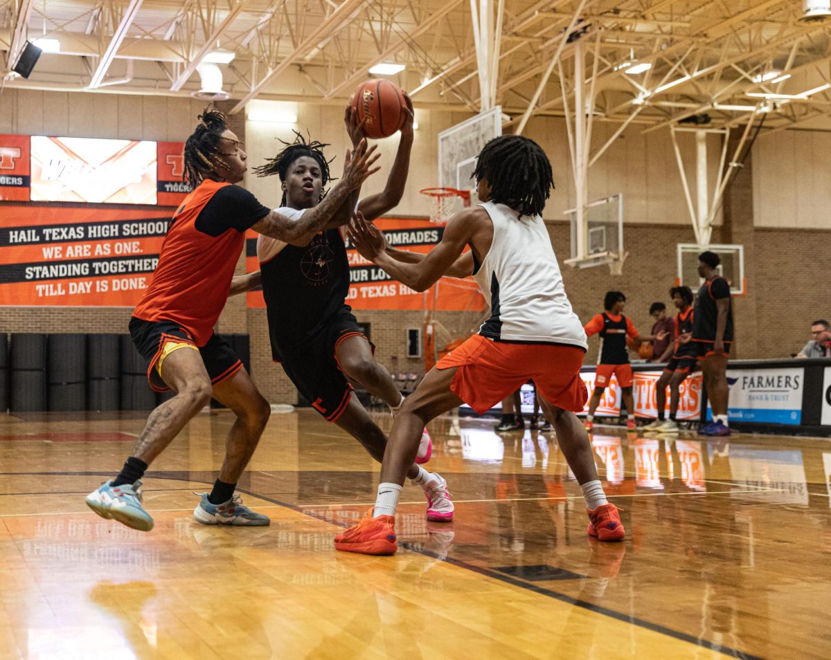 Junior Tre Ellis slashes through defenders in practice Thursday, Nov. 16, 2023. The Tigers are going into the new season with a brand new head coach, Eric Cross.