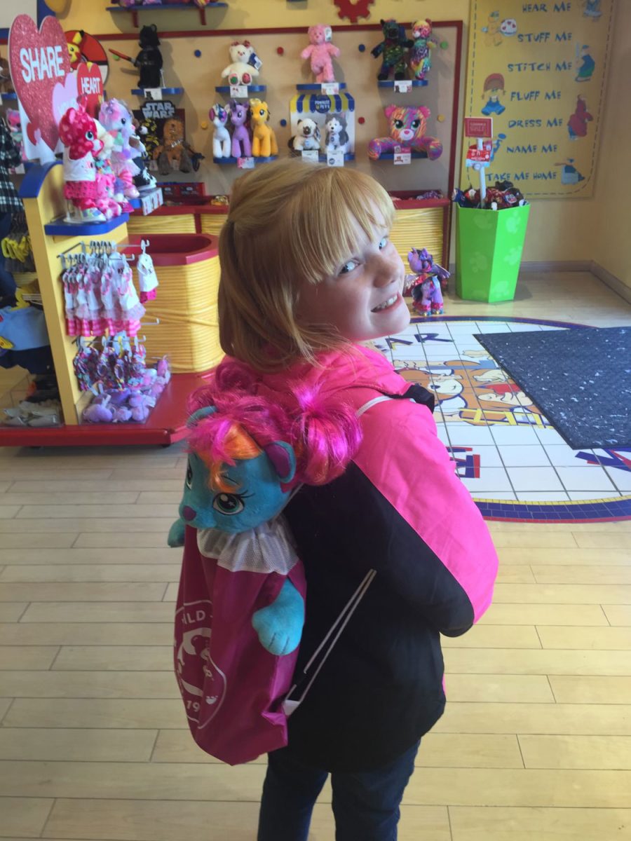 Sophomore Kateleigh Crowson smiles when she was younger after making a bear in Build-A-Bear. Crowson was adopted by her parents when she was a baby.