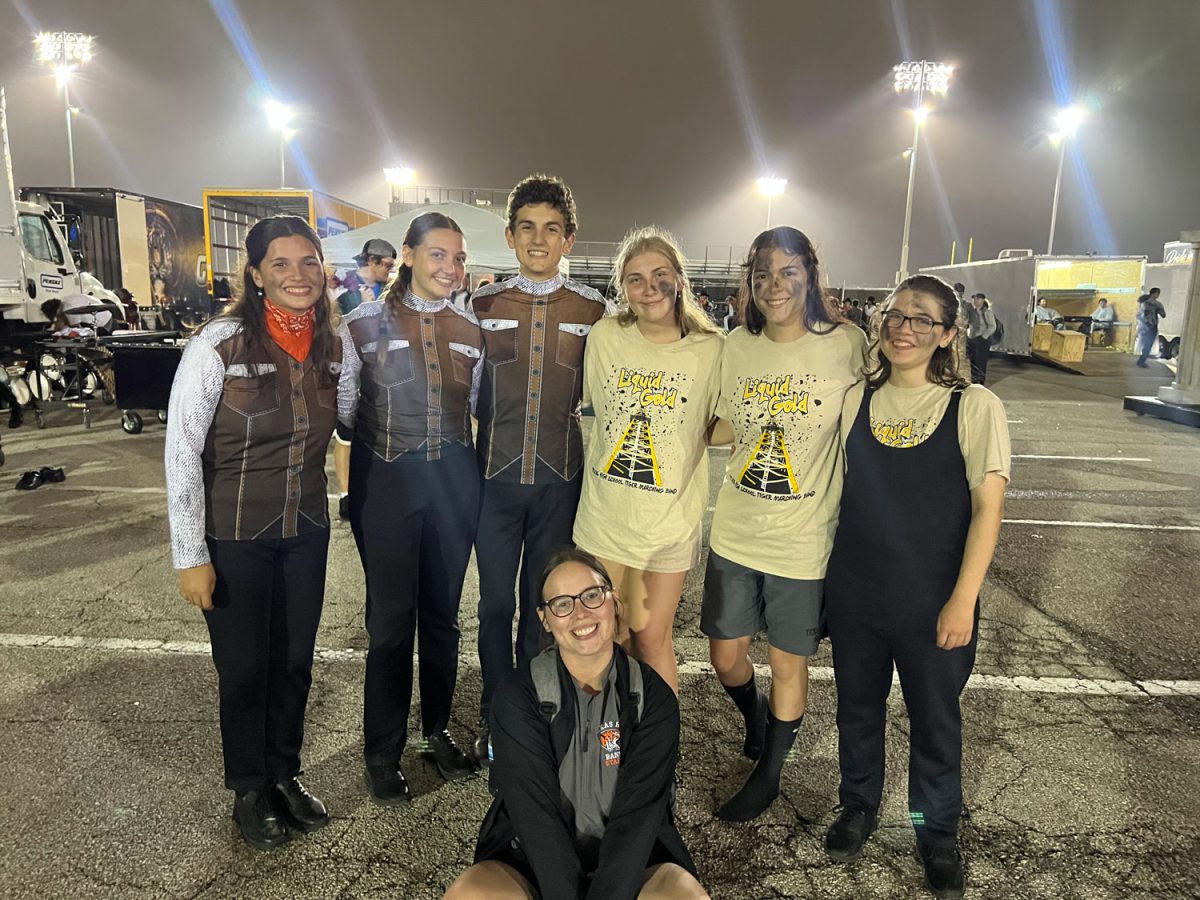 Band students stand beside each other after their Area competition for UIL on Oct. 28, 2023. Tiger Band placed ninth in the competition.