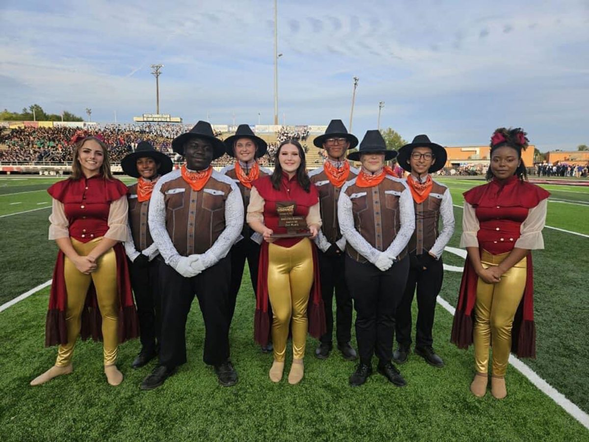 Members of the Tiger Band stand beside each other after their band competition on Oct. 14, 2023. Band placed 2nd in the competition. 