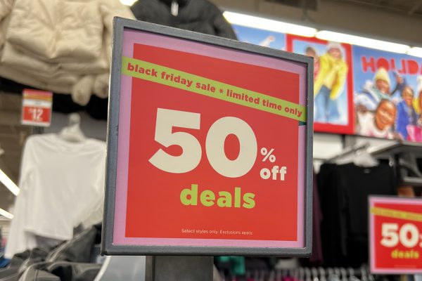 Sign shown on Black Friday at Old Navy. The store offered 50% off prices and discounts along with many others in the area.
