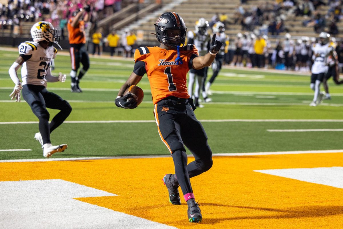 Senior TJ Gray celebrates a touchdown in a district game against Nacogdoches Friday, Oct. 20, 2023. The Tigers ended their season with an overall record of 11-2.