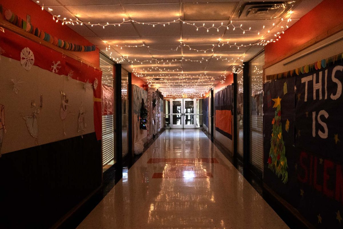 Christmas music and decoration line the walls and ceiling of hallway six as part of the inaugural hallway decorating contest at Texas High school. Teacher of hallway six won the contest with their craftyness and ability to bring music to the hallway during the school day.