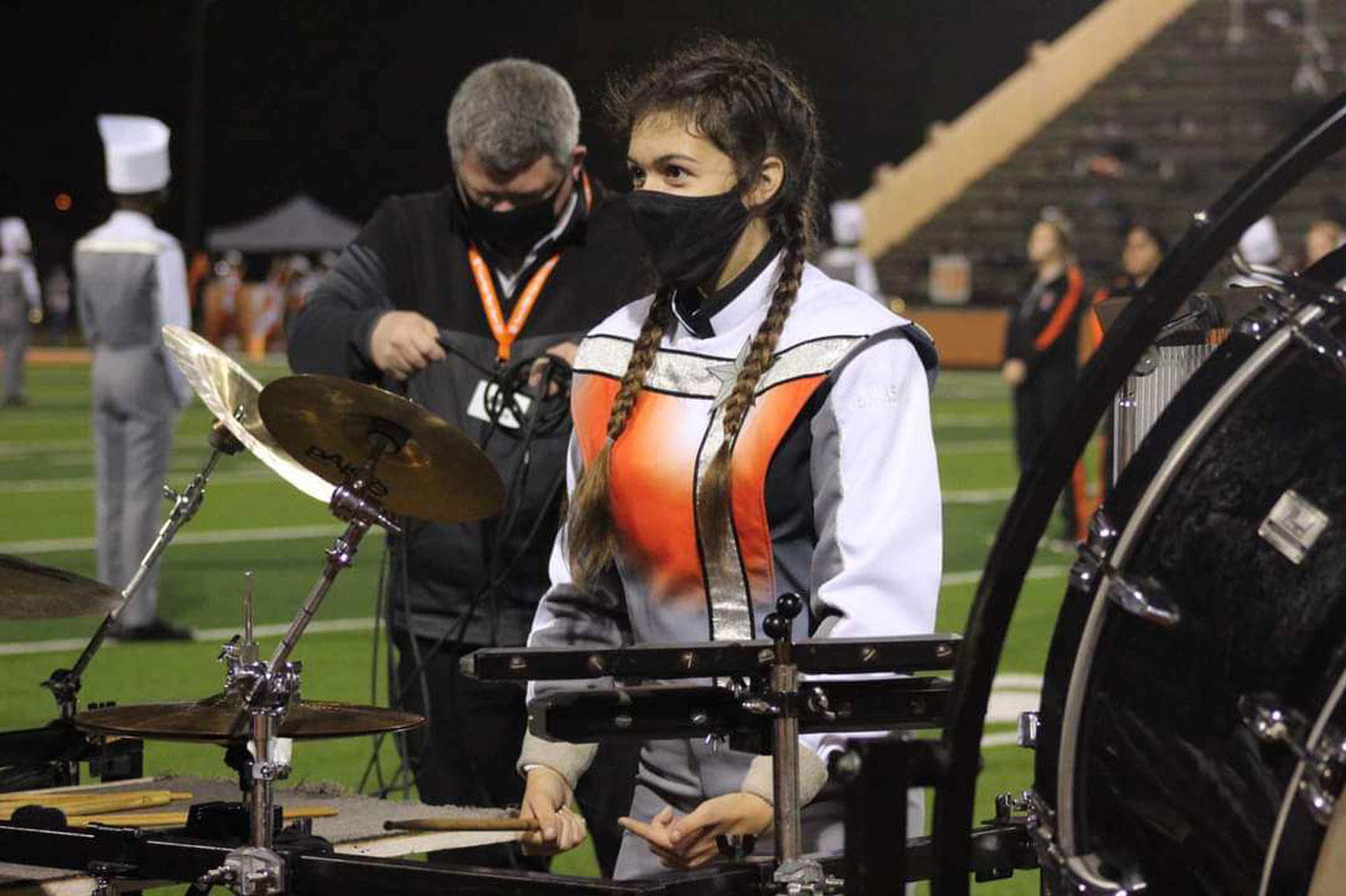 SUBMITTED PHOTO BY LOUREDES QUIJAS: Looking ahead, Lourdes Quijas stands in front of her instrument before their half time show during a football game her freshman year.