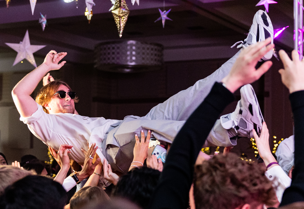 Senior River Shelton surfs the crowd at the Texas High School Prom dance. The dance was held at the Texarkana Convention Center on May 13, 2023.