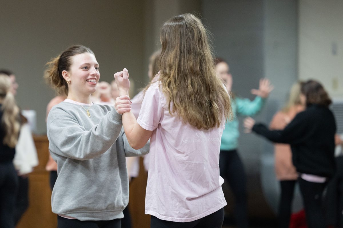 Senior Ella Graham holds the wrist of another student at their self defense meeting on Jan. 8, 2024. The Rosebuds learned several ways to defend themselves. 