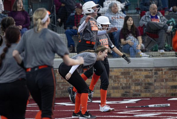 Seniors Mally Lumpkin and Anna Lee scream and jump in celebration after fellow teammate, senior Mollie Fisher, hit a homerun Friday, Feb. 2, 2024. The Lady Tigers will kick off their district season in the beginning of March.