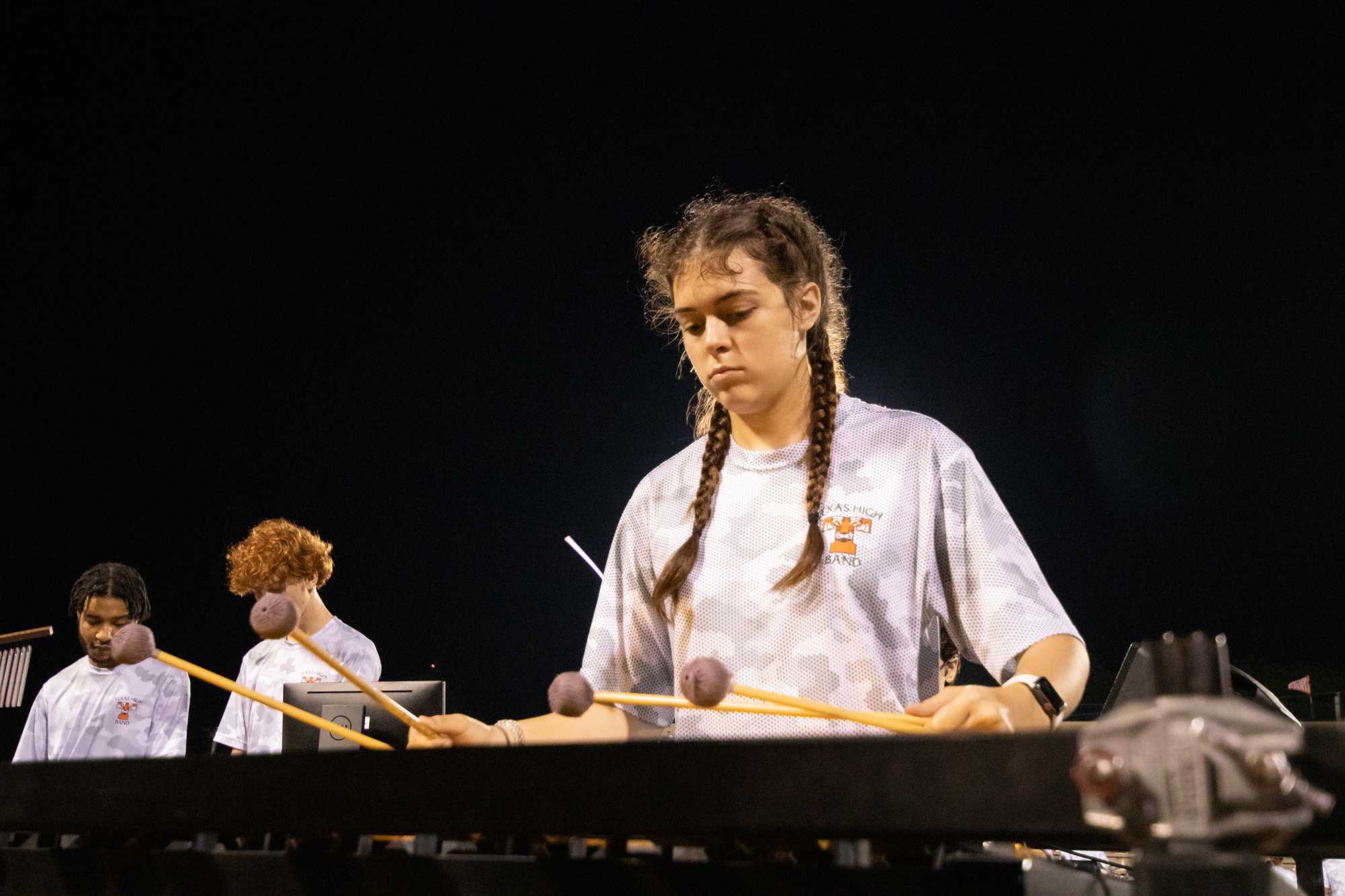 Concentration clear on her face, Lourdes Quijas plays the vibraphone in Queen of the night her junior year.
