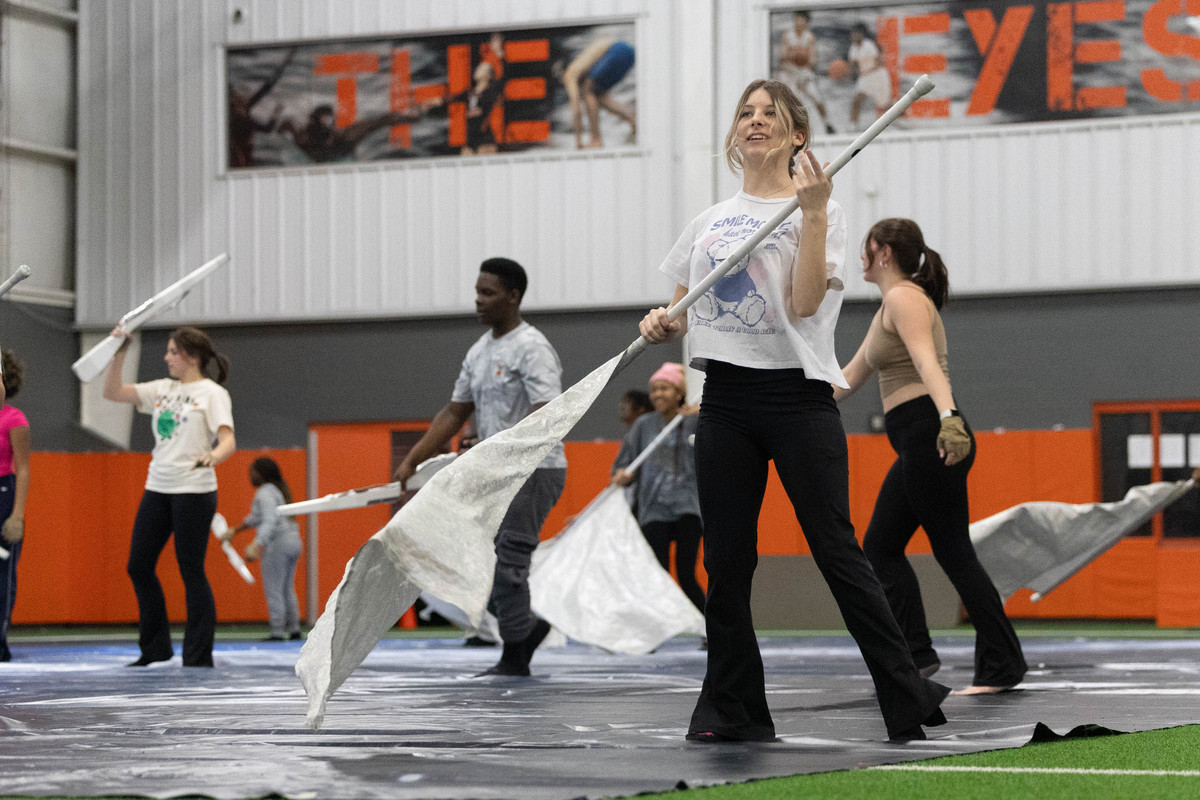 Junior+Birklie+Kimble+prepares+to+toss+her+flag+into+the+air.+Texas+High+winter+guard+practices+their+performances+in+the+multipurpose+center.