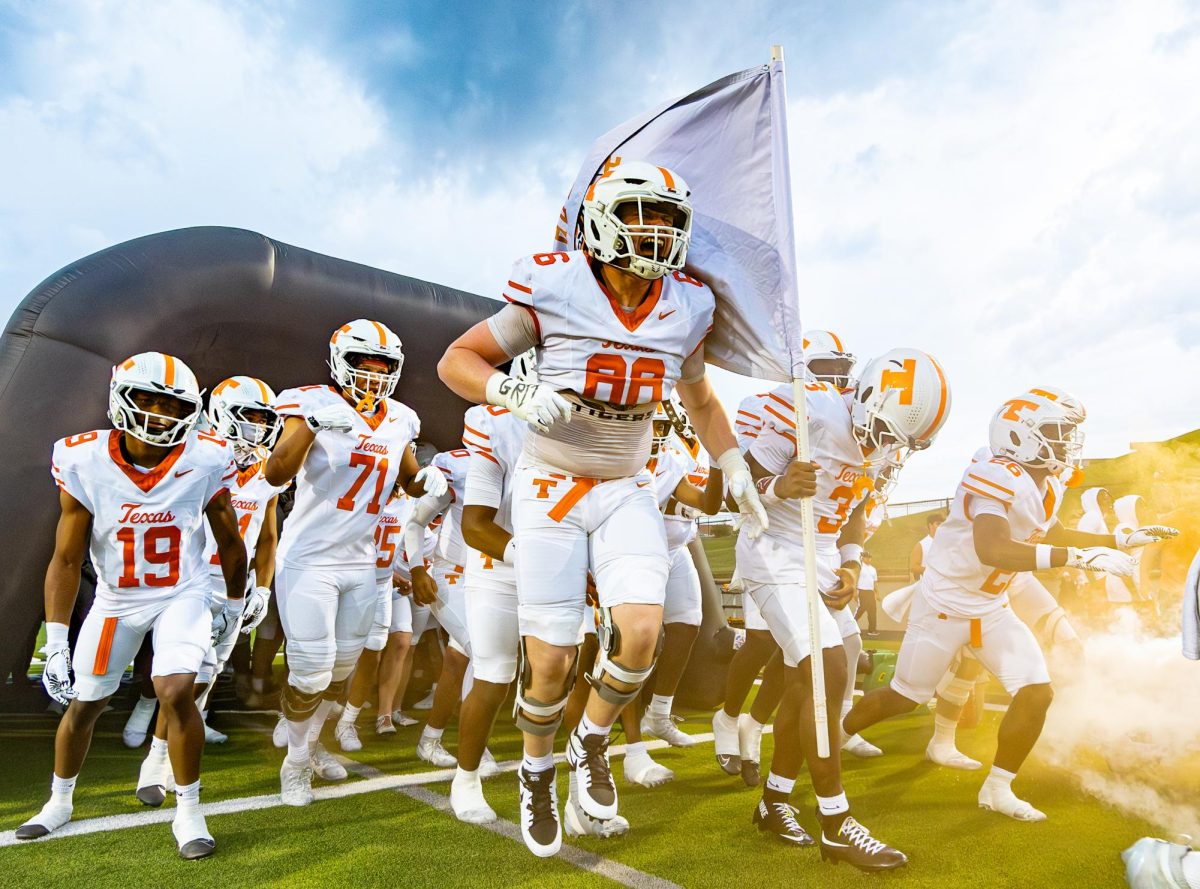 Senior left guard, Damien Chisum, leads the Tigers out of the run-out tunnel at Trinity Mother Frances Rose Stadium in Tyler, Texas on Aug. 29, 2025. 