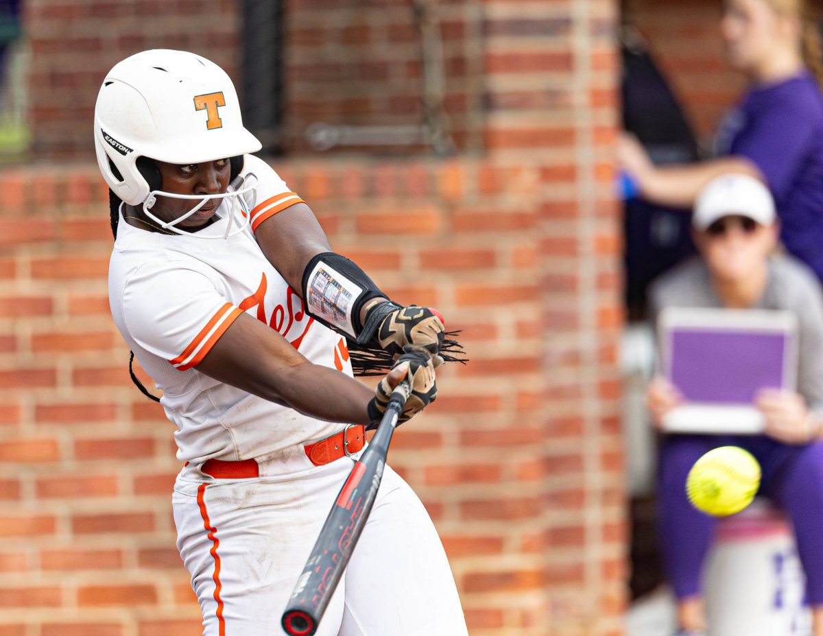 Senior Sydney Woods swings the bat during a district match up against Hallsville at home. Woods signed to continue her academic and athletic career at Regis University. 