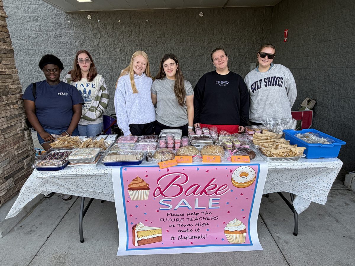 TAFE students smile as they prepare for their annual bake sale, getting ready for future competitions. Texas High’s Texas Association of Future Educators (TAFE) students earned their way to the national level this year.