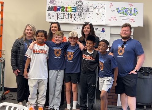 On April 27, 2026, the Mystery Cowboys robotics team smiled with their coaches at their send-off to the world championships. Texas High School hosted the send-off in Susan Waldrep's room.